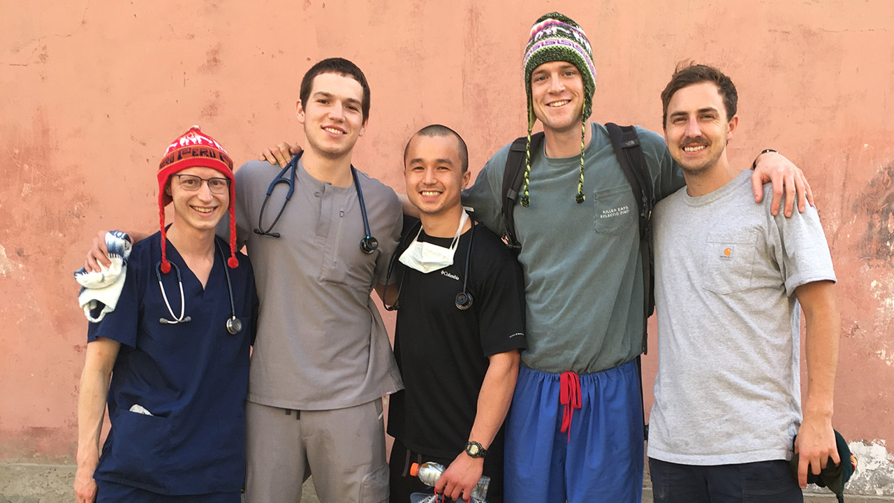 Group of five male medical students standing outdoors in Peru