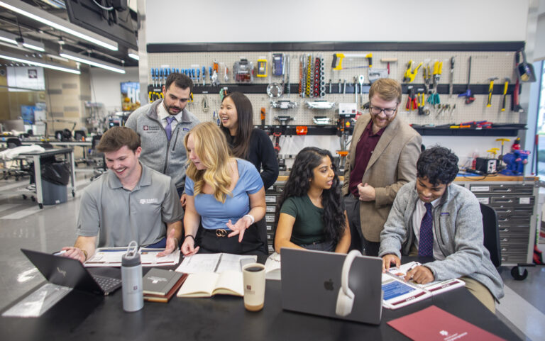 EnMed students and faculty at work station in Innovation Lab